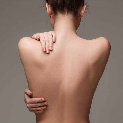 woman-back-hands-skin